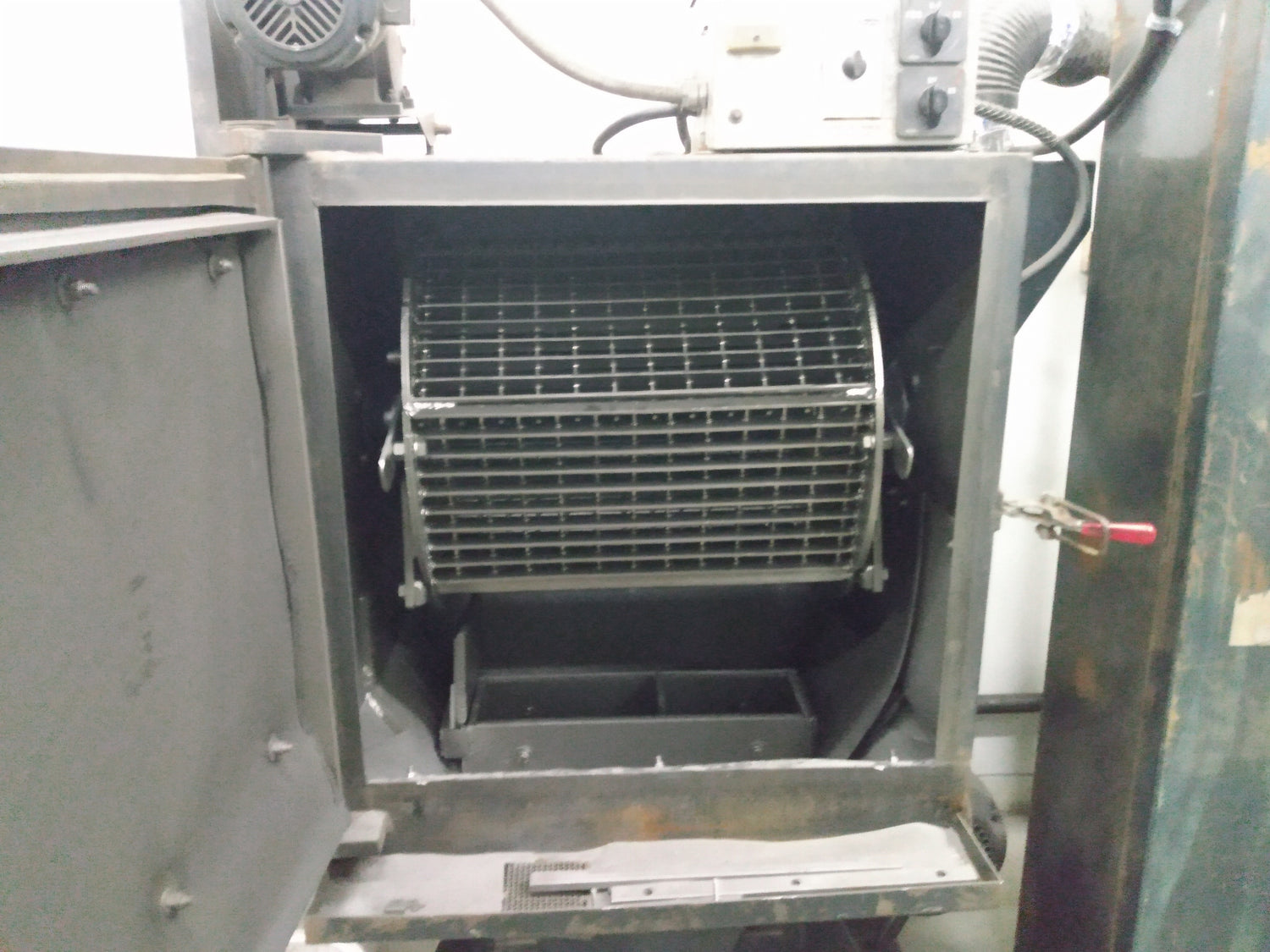Image of LS 4.5B Tumble Blaster with open door showing internal part cage.