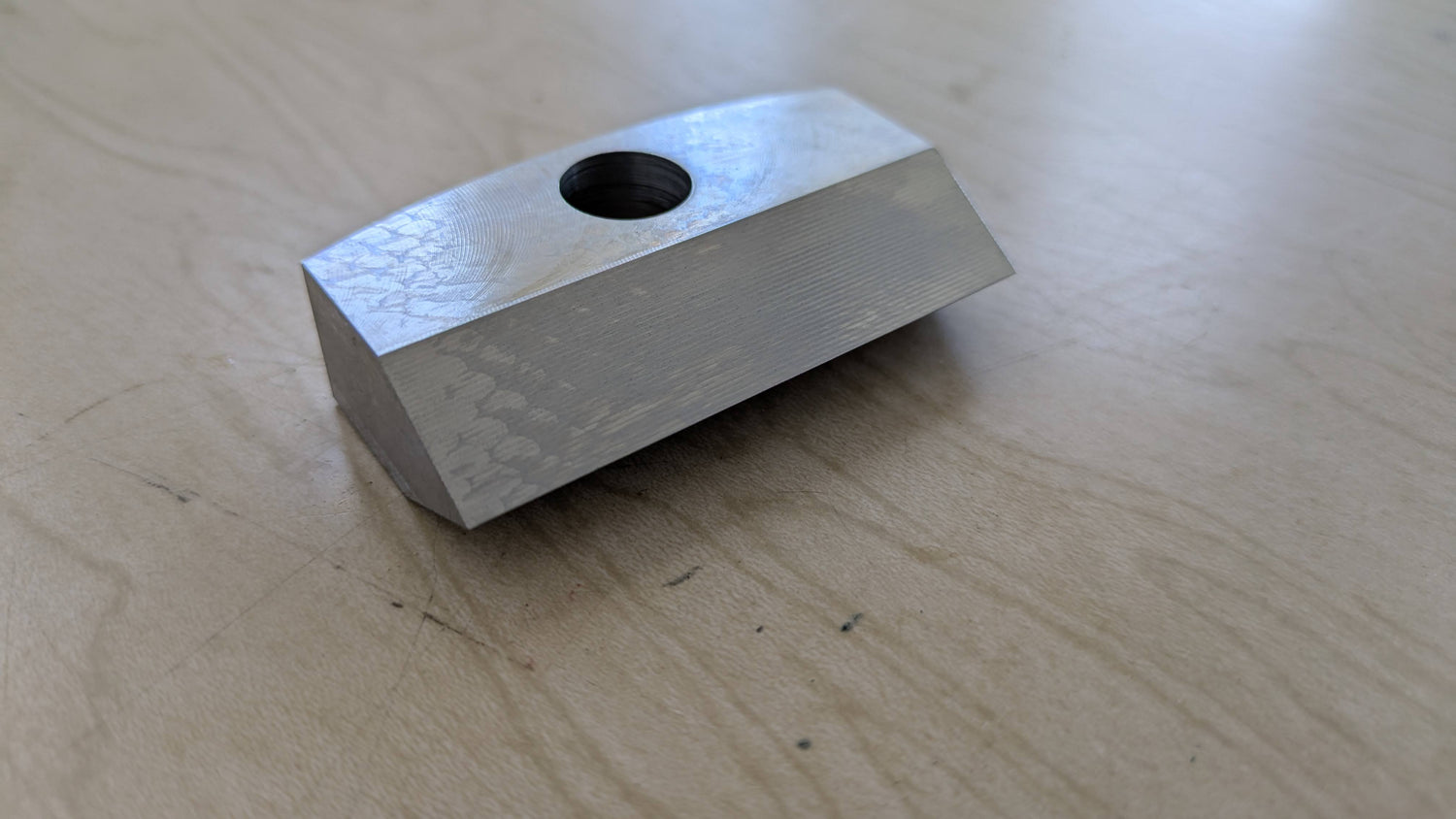 Strain point for bandmill sitting on wooden table.