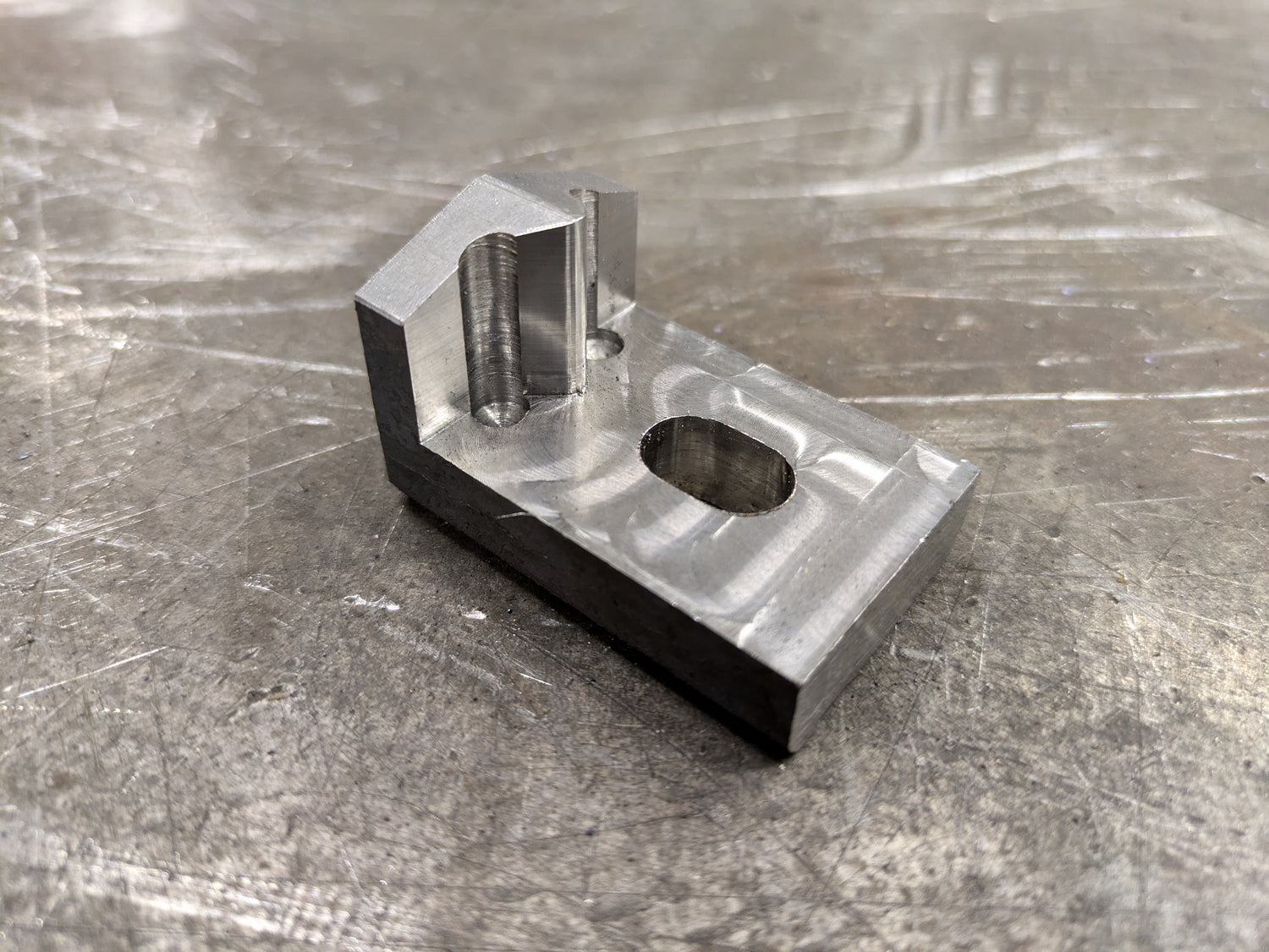 End stop for a press brake fixture, machined out of 4140 steel.