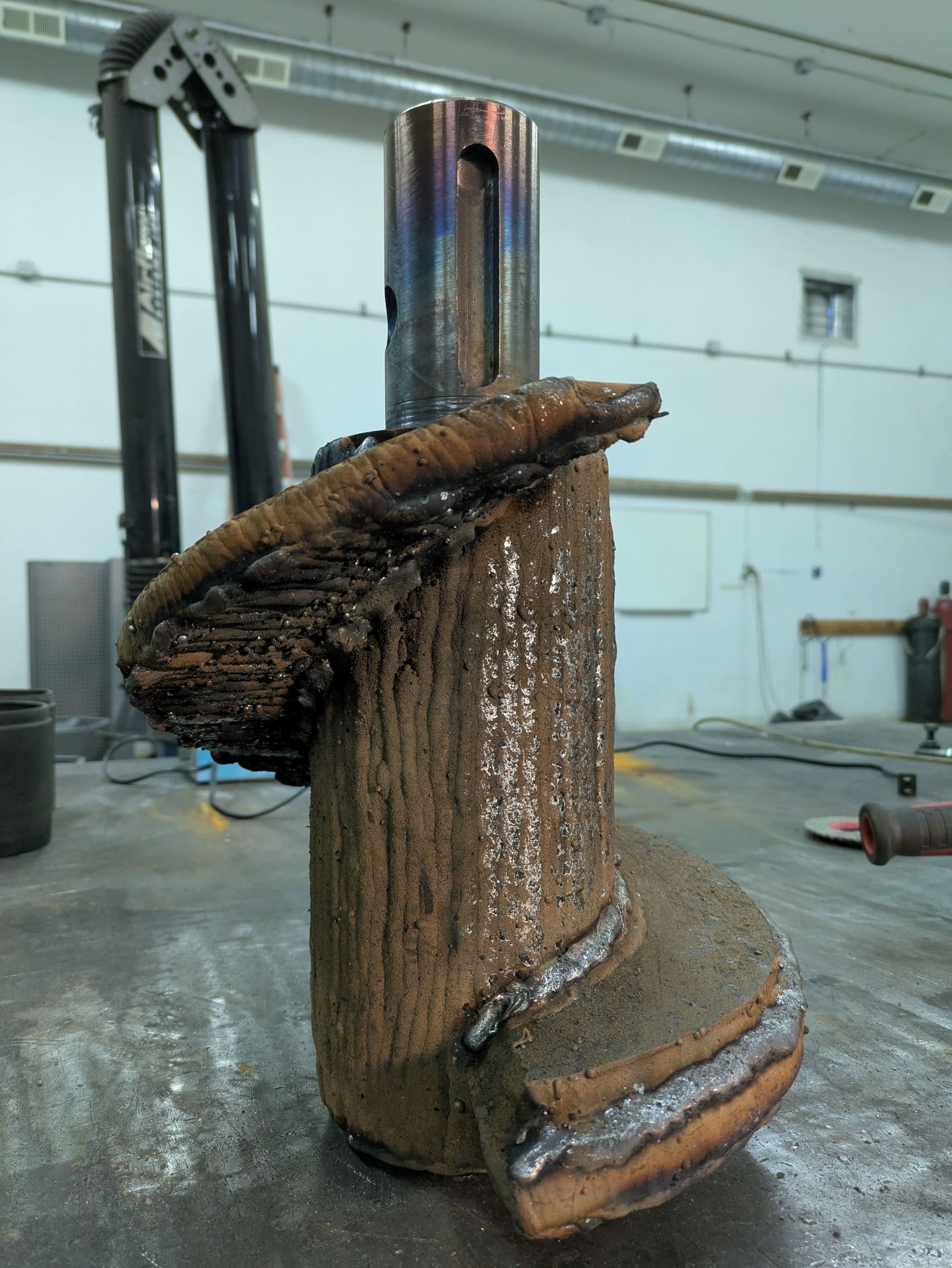 Chrome carbide hardfaced auger tip for plastic recycling.