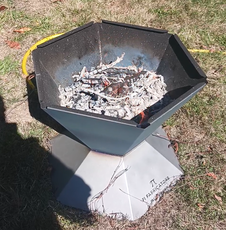 biochar fire pit with char burned down. Ready for more wood. 