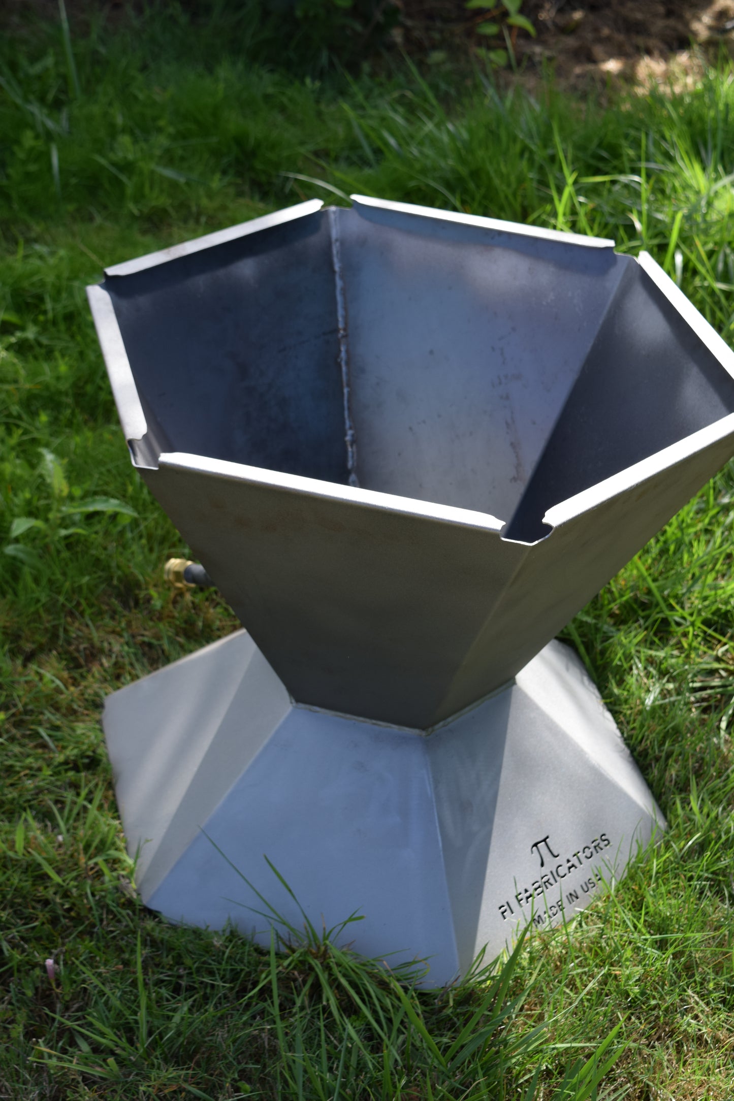 A photo of the biochar fire pit with a downward facing diagonal perspective. 