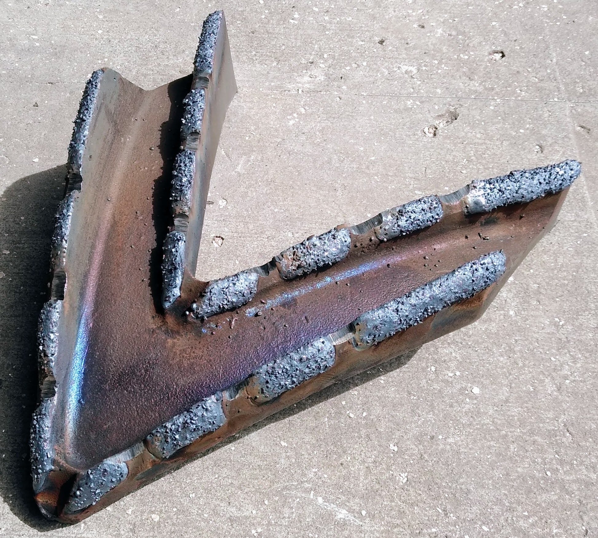 Hardfaced debarker part for wood products industry. Hardfaced with embedded carbide for enhanced wear resistance.