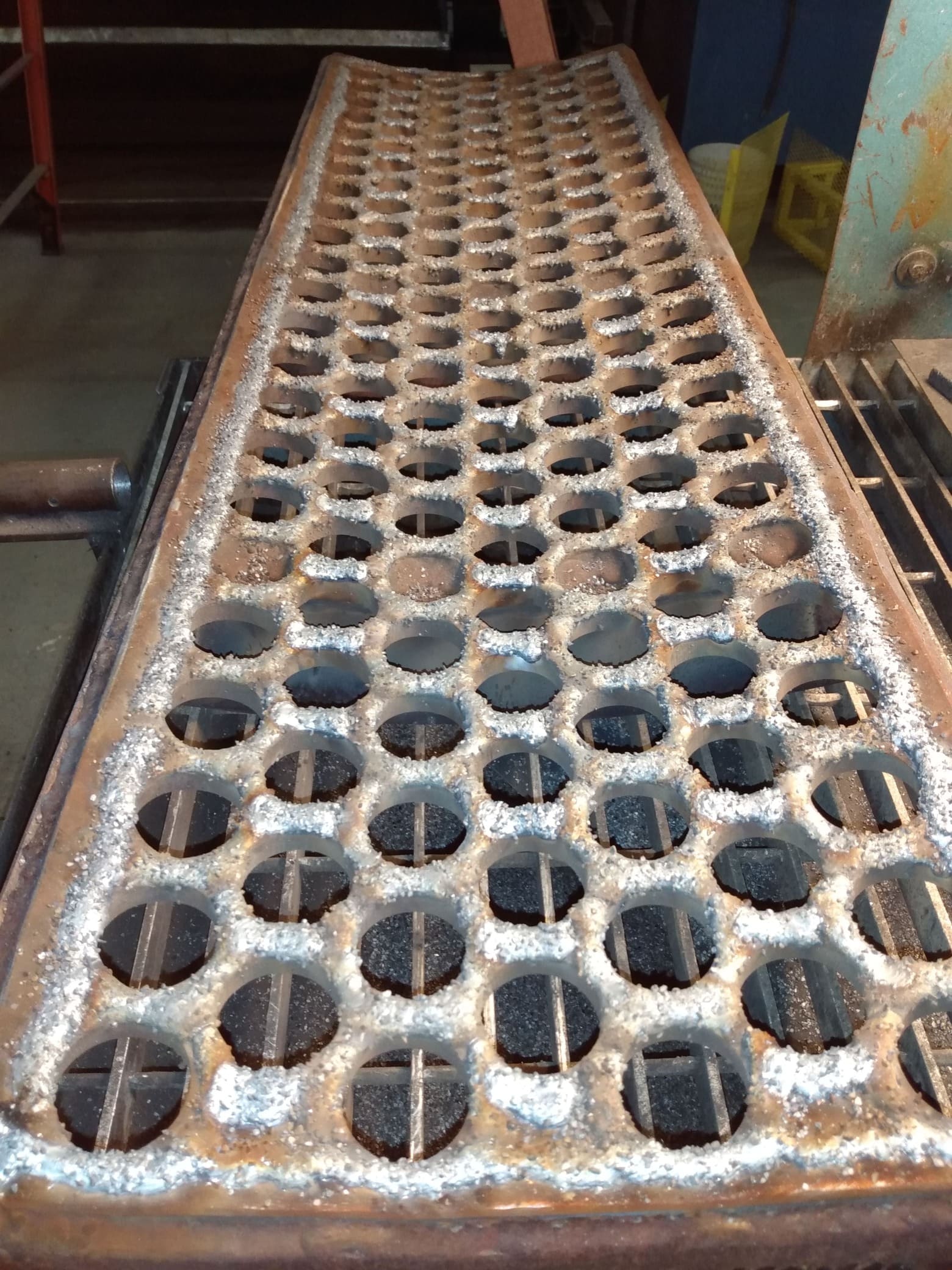 Hog grate used for wood size reduction, featuring embedded carbide to ensure a very long wear life.