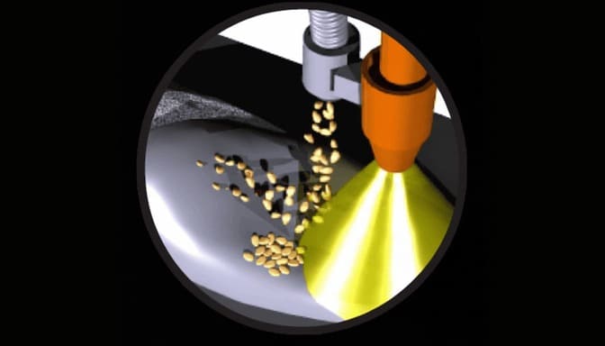 Digital rendering of a MIG welding head arc spray welding with a tungsten carbide feed tube dropping tungsten carbide grit into a molten pool of tool steel.